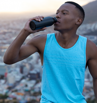man drinking energy drink